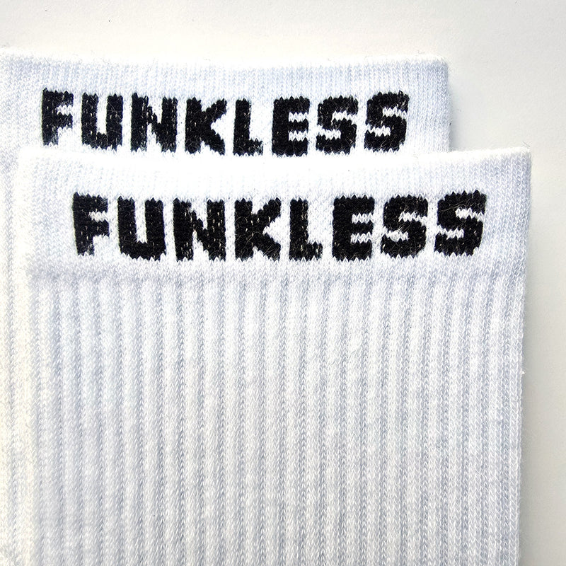 Close-up of the ribbed knit and FUNKLESS cuff on Arctic White Crew socks